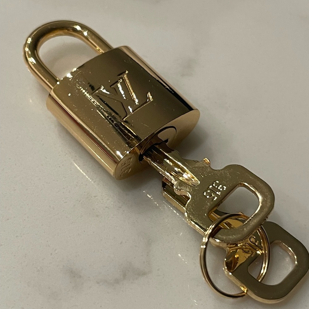 Authentic Louie Vuitton padlock with 2 keys